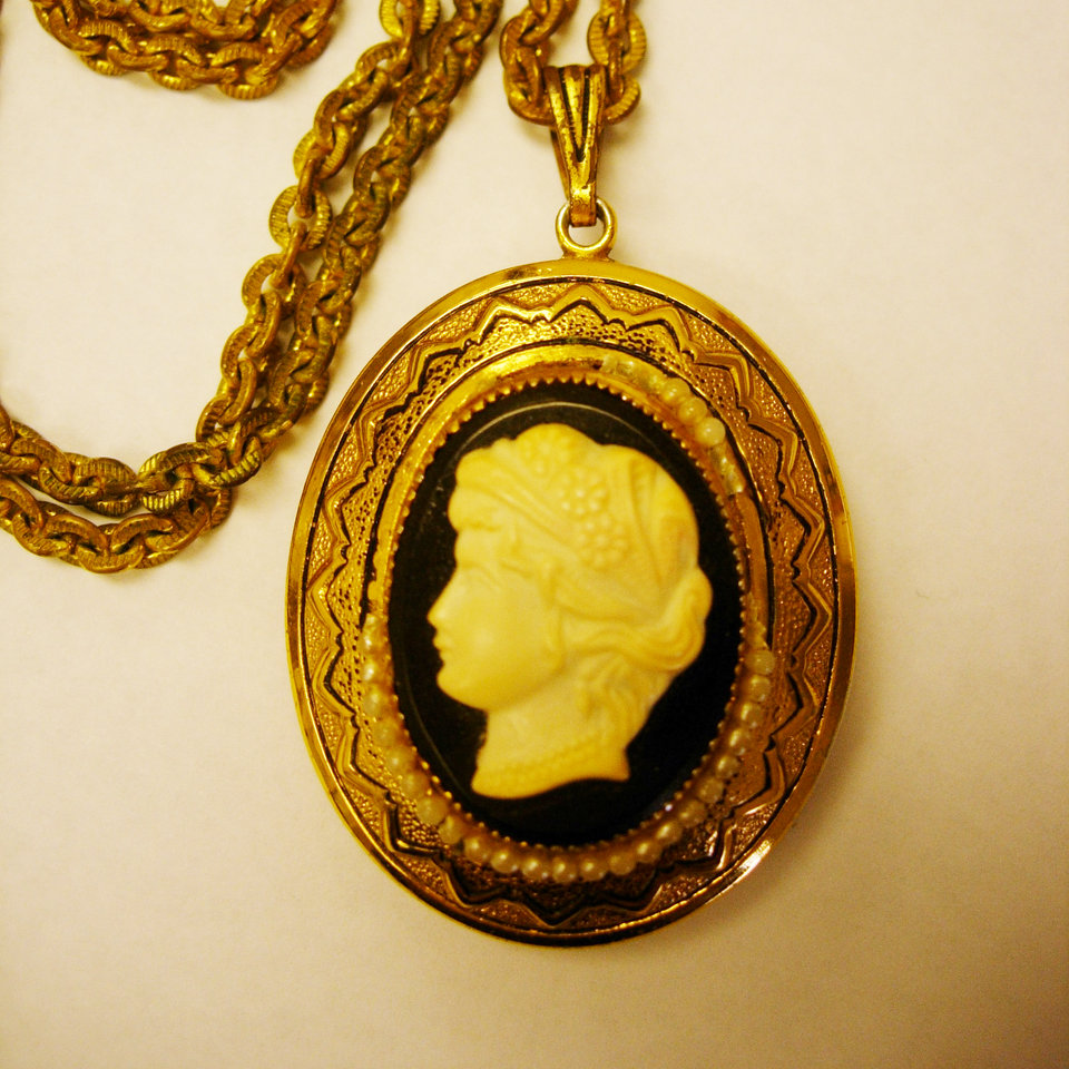 Cameo locket and chain in bad shape