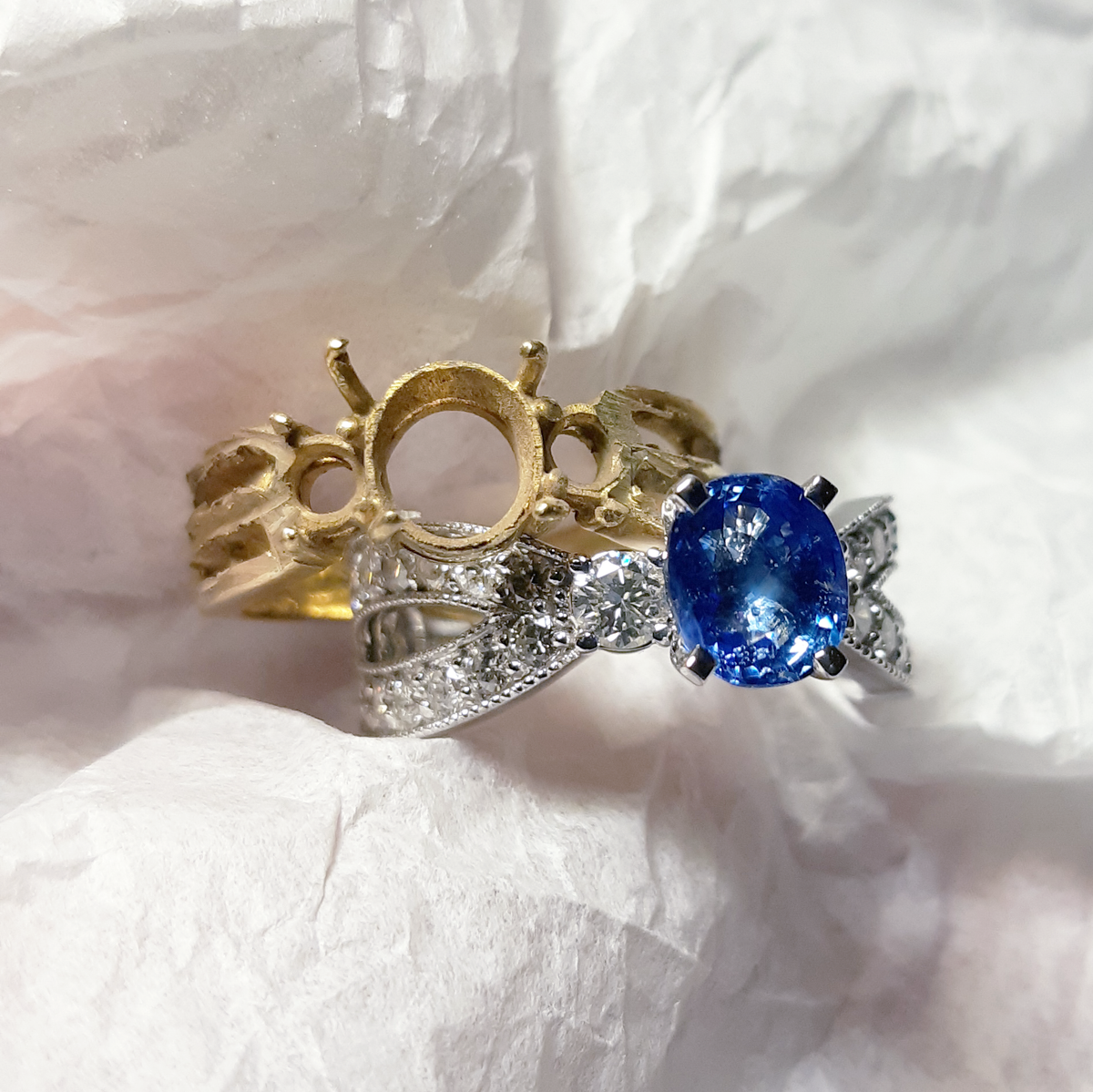 14K white gold with sapphire and diamonds.
